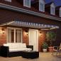 Preview: Manuelle Gelenkarmmarkise mit LEDs 5 x 3 m